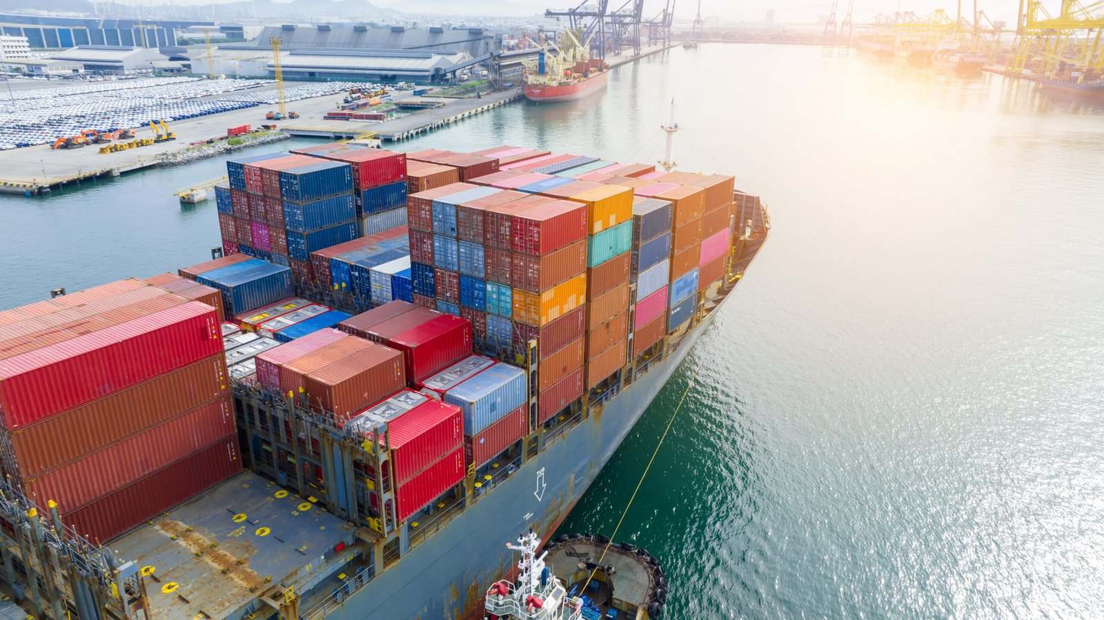 tugboat pull container cargo ship vessel to cargo international